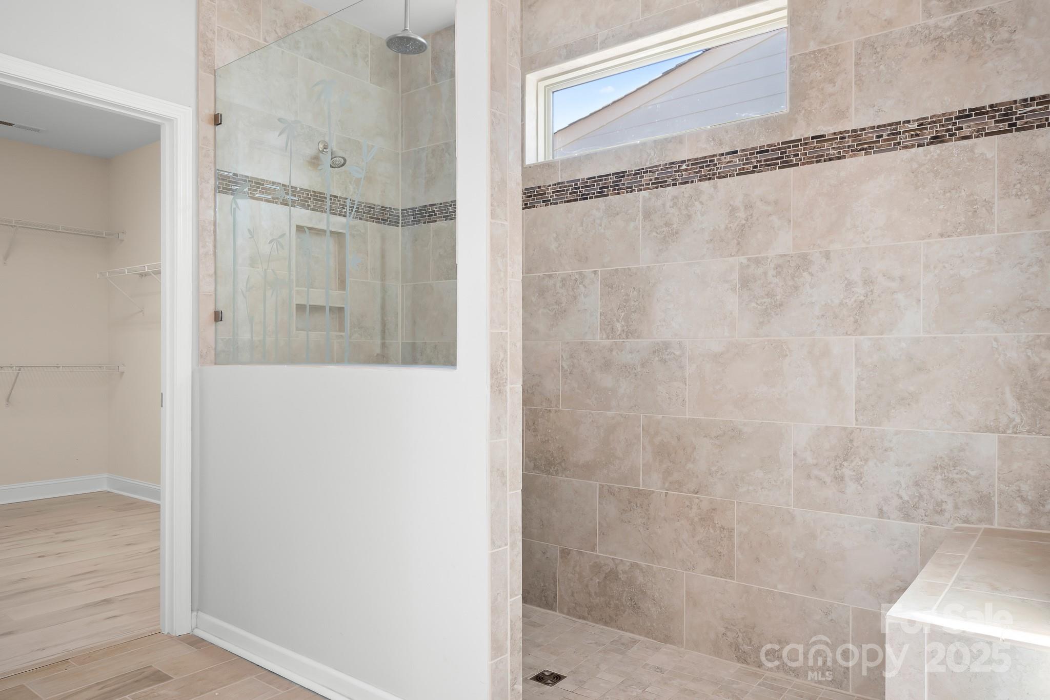 910 Kirby Drive Fort Mill, SC 29715 - Photo 17 of 30 a bathroom with a glass shower door