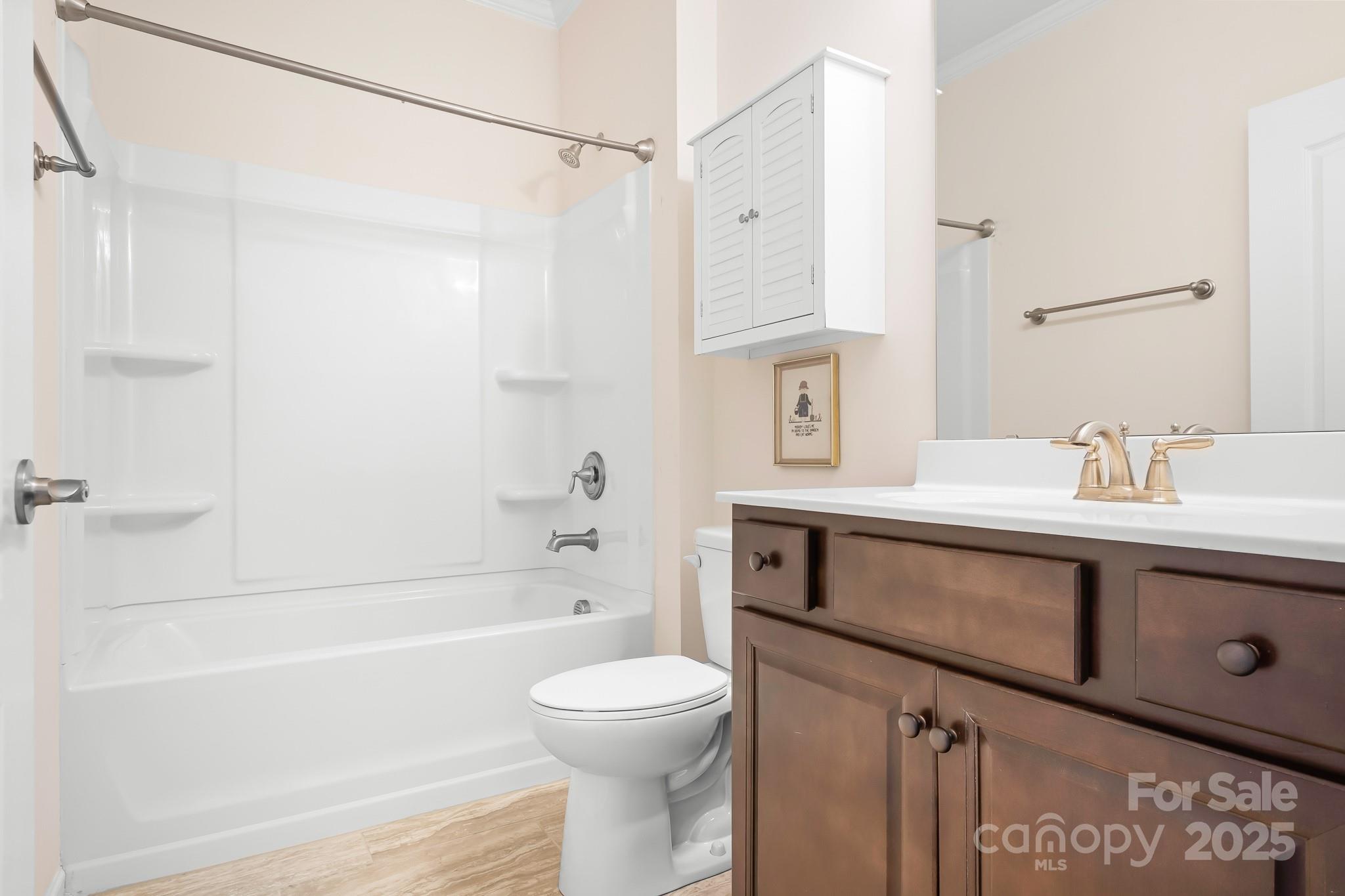 910 Kirby Drive Fort Mill, SC 29715 - Photo 19 of 30 a bathroom with a sink a toilet and shower