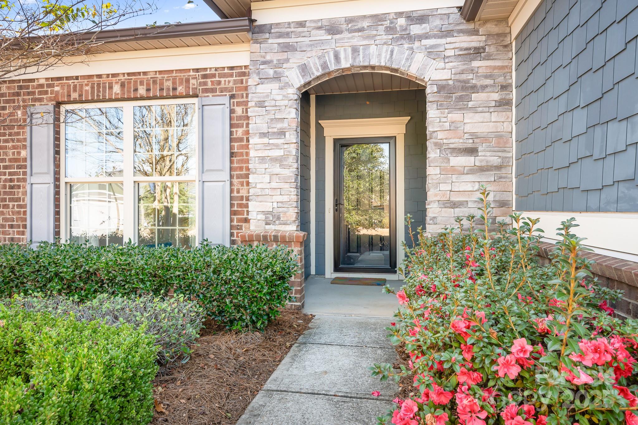910 Kirby Drive Fort Mill, SC 29715 - Photo 2 of 30 a front view of a house with a garden