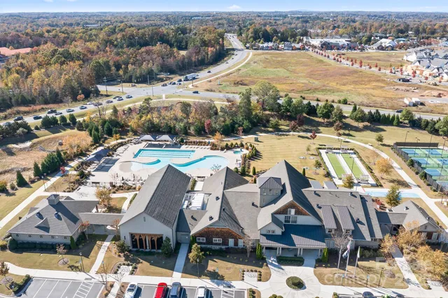 an aerial view of a house with outdoor space