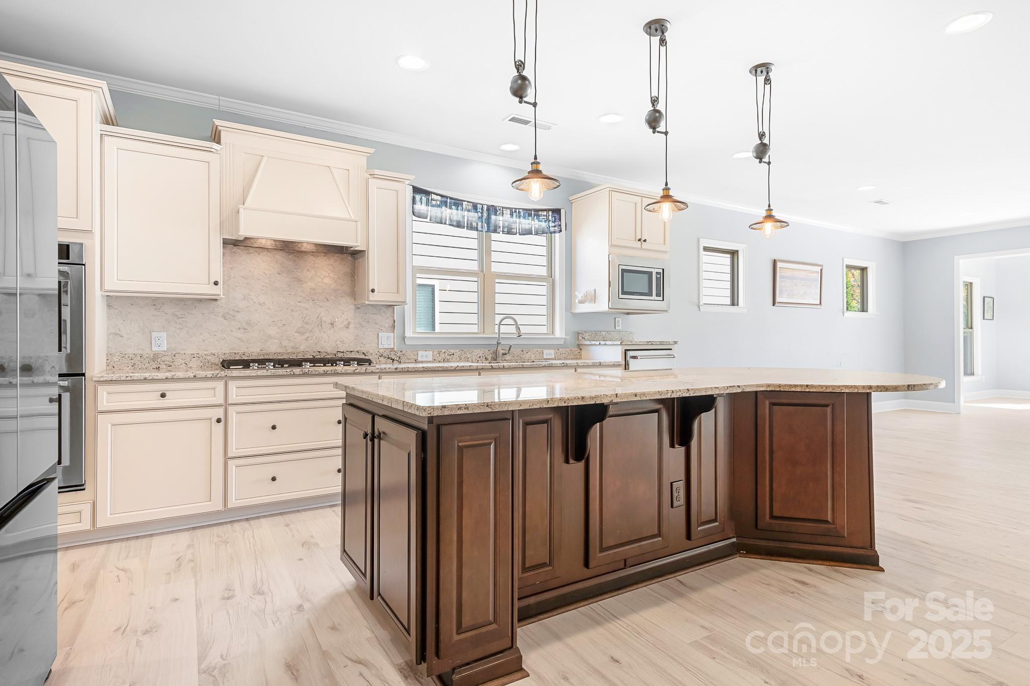 910 Kirby Drive Fort Mill, SC 29715 - Photo 4 of 30 a kitchen with granite countertop a sink cabinets and window