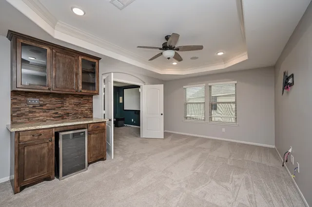 a view of a kitchen with a sink and microwave