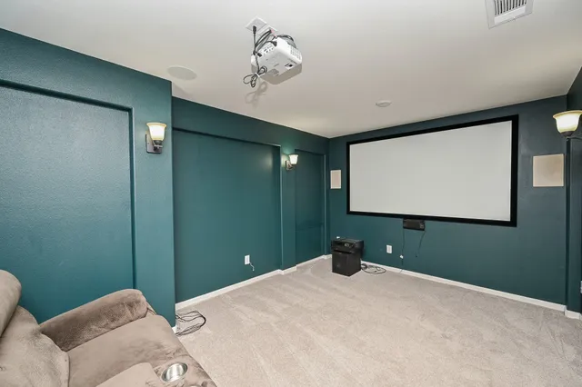 a bedroom with a bed and a wall painting