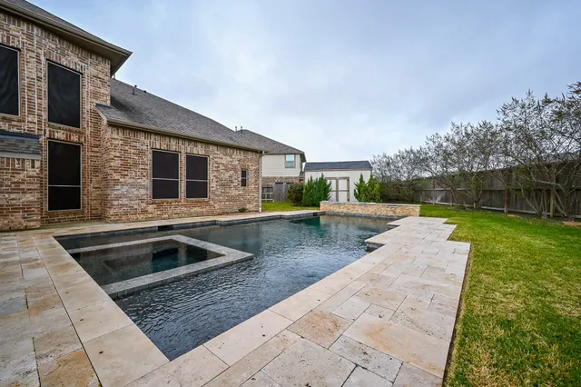 a view of outdoor kitchen with sink and outdoor seating