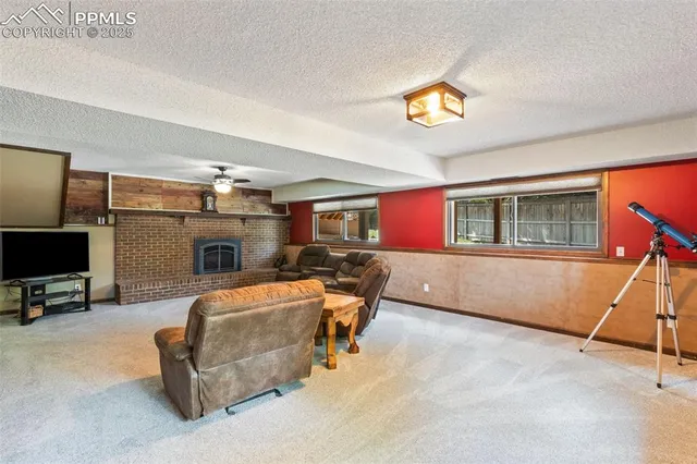 a bedroom with furniture and a flat screen tv