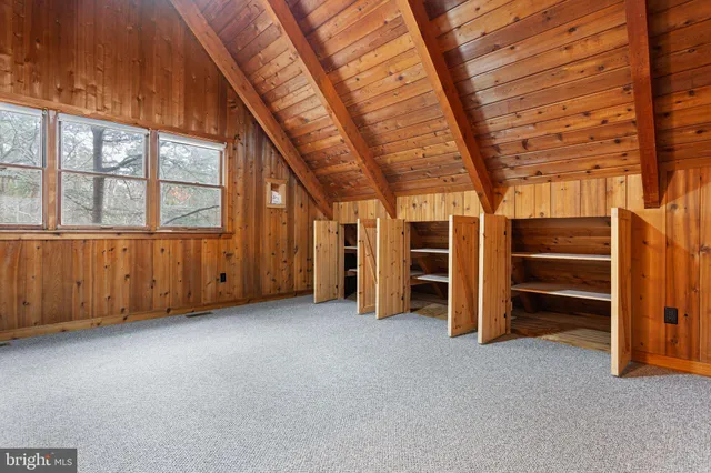 an empty room with an empty space and wooden walls