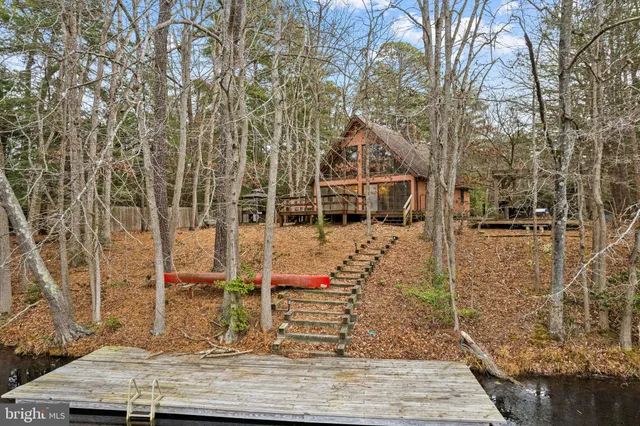 a view of a chairs and table in the patio