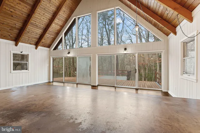 a view of an entryway with a floor to ceiling window