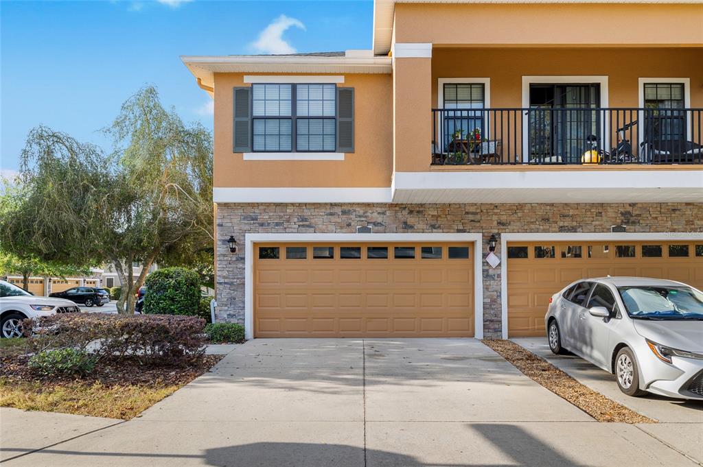 a front view of a house with parking space