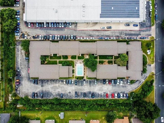 a aerial view of a house with a garden and plants