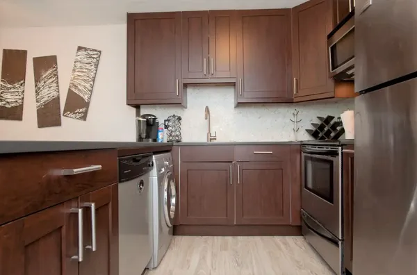 a kitchen with a sink and cabinets