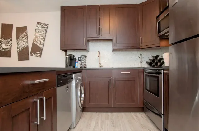 a kitchen with a sink and cabinets