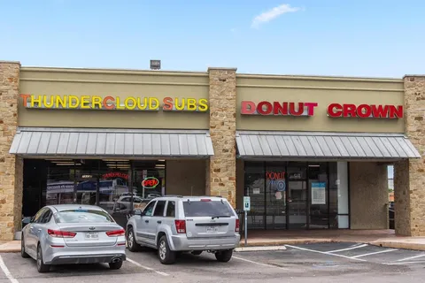 a view of a car park with a garage