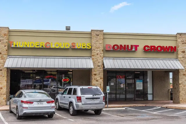 a view of a car park with a garage