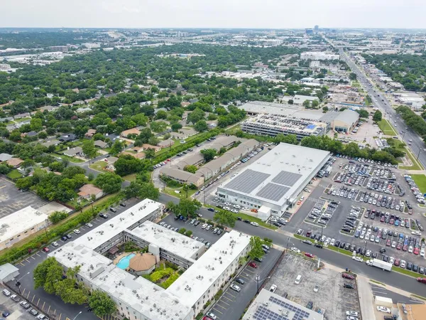 an aerial view of residential houses with outdoor space