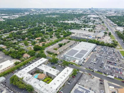 an aerial view of residential houses with outdoor space