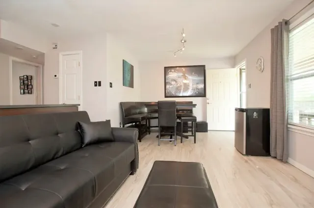 a living room with furniture and a window
