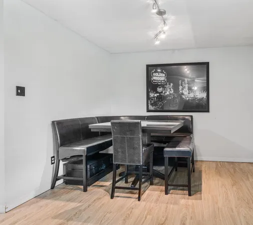 a workspace with furniture and wooden floor