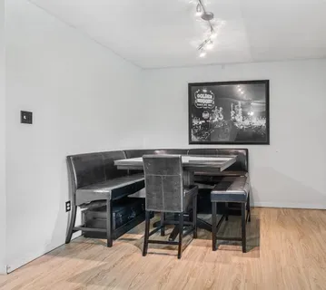 a workspace with furniture and wooden floor