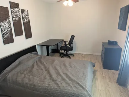 a workspace with furniture and wooden floor