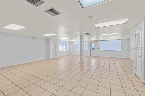 a view of an empty room and a window