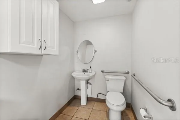 a bathroom with a toilet and a sink