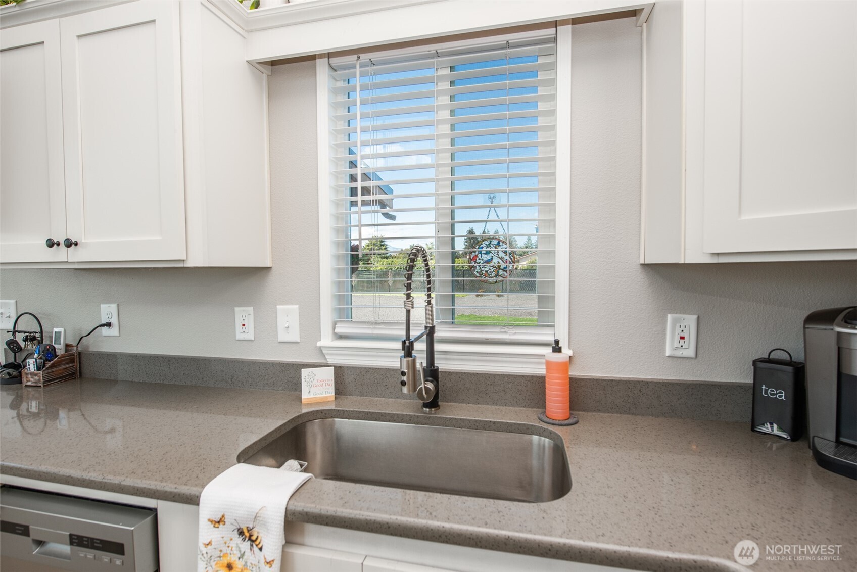82 Williamson Road Sequim, WA 98382 - Photo 14 of 40 a kitchen with granite countertop a sink and a white wooden cabinets