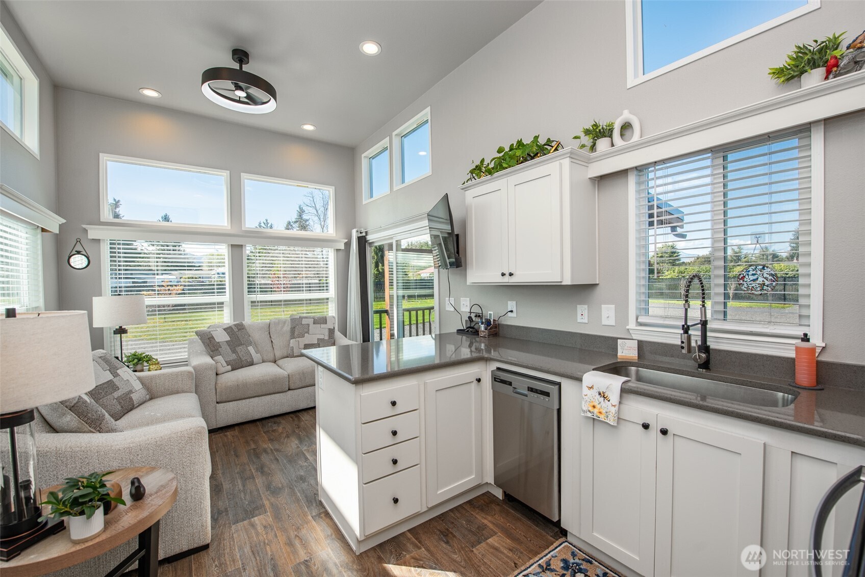 82 Williamson Road Sequim, WA 98382 - Photo 17 of 40 a kitchen with furniture a large window and cabinets