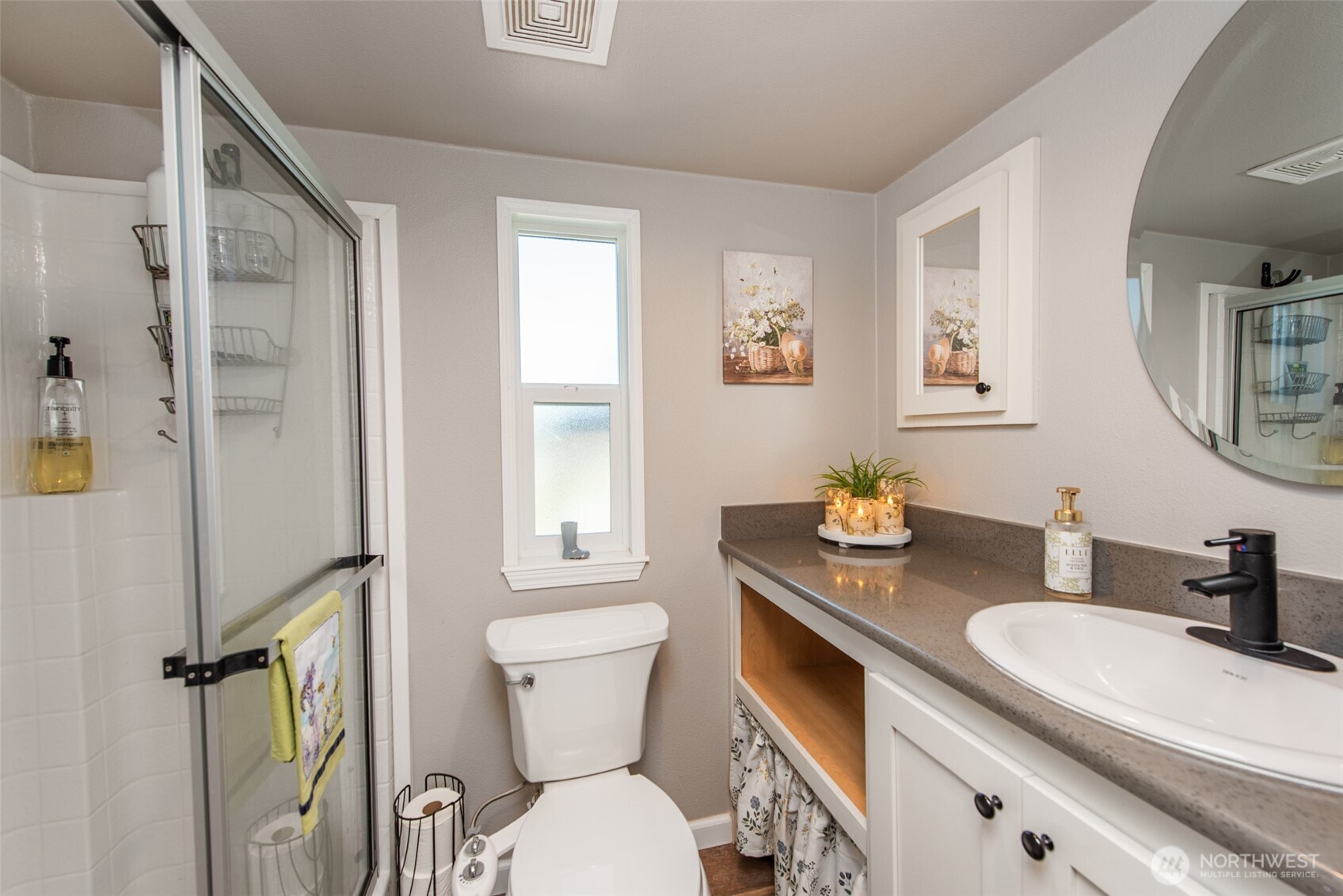 82 Williamson Road Sequim, WA 98382 - Photo 21 of 40 a bathroom with a granite countertop sink mirror vanity and toilet