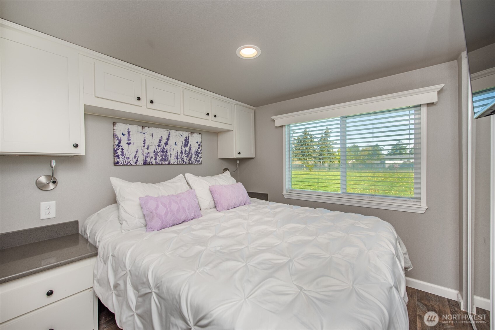 82 Williamson Road Sequim, WA 98382 - Photo 22 of 40 a bedroom with a large bed and a window