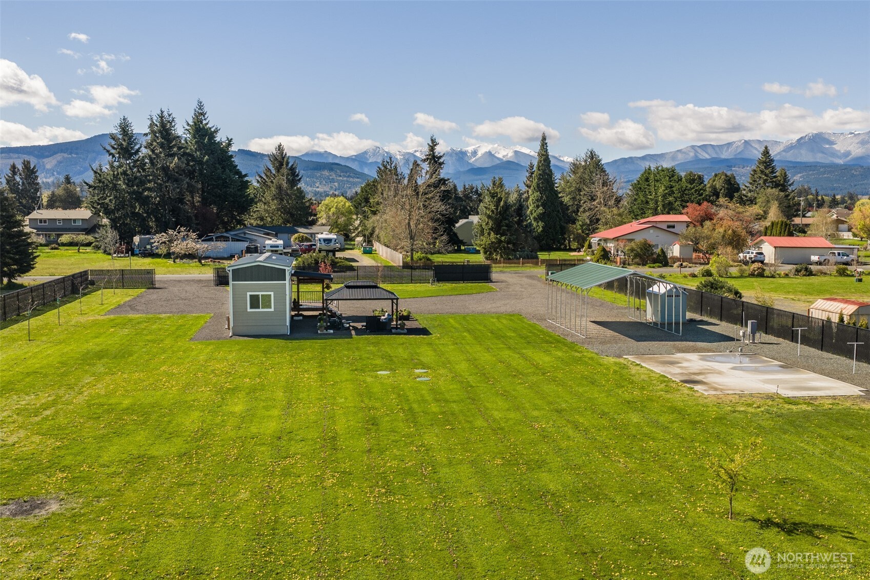 82 Williamson Road Sequim, WA 98382 - Photo 5 of 40 a view of a swimming pool and lake in the back