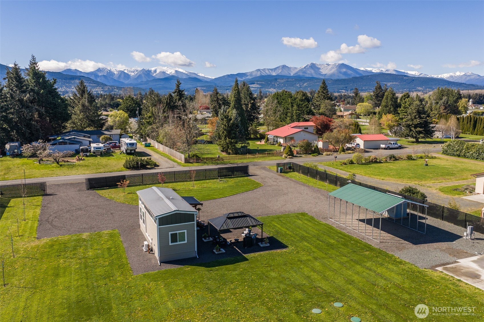 82 Williamson Road Sequim, WA 98382 - Photo 6 of 40 a view of a swimming pool patio and mountain view
