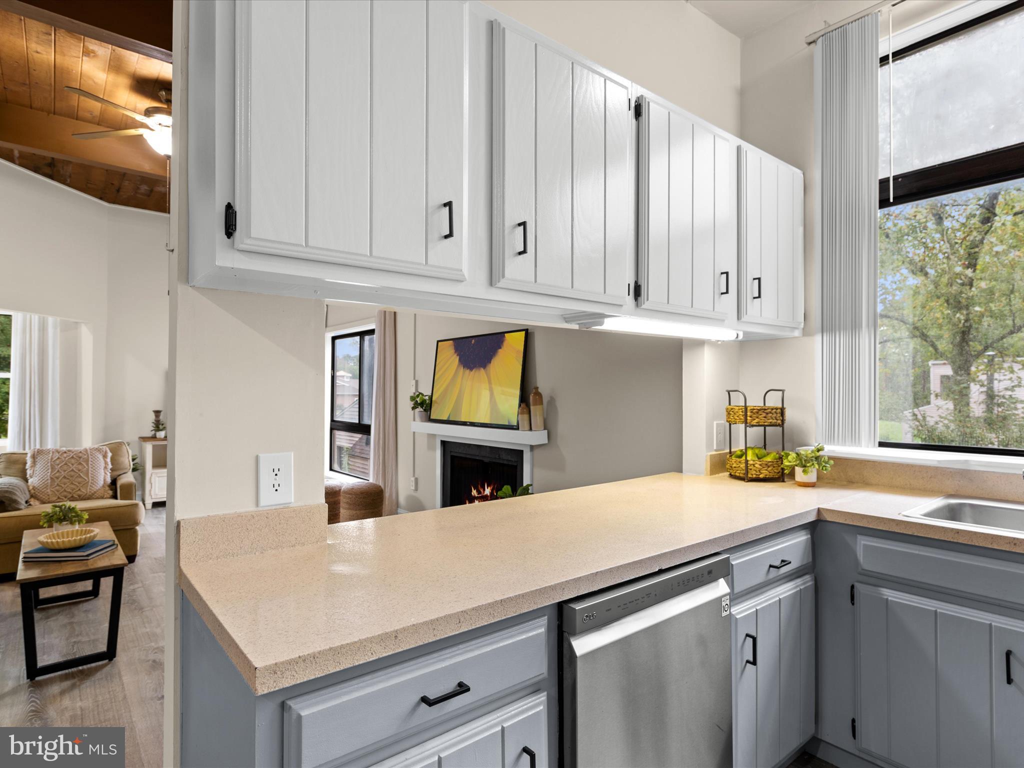 438 Ocean Parkway, Unit 4 Berlin, MD 21811 - Photo 16 of 81 a kitchen with stainless steel appliances a white cabinets and a sink