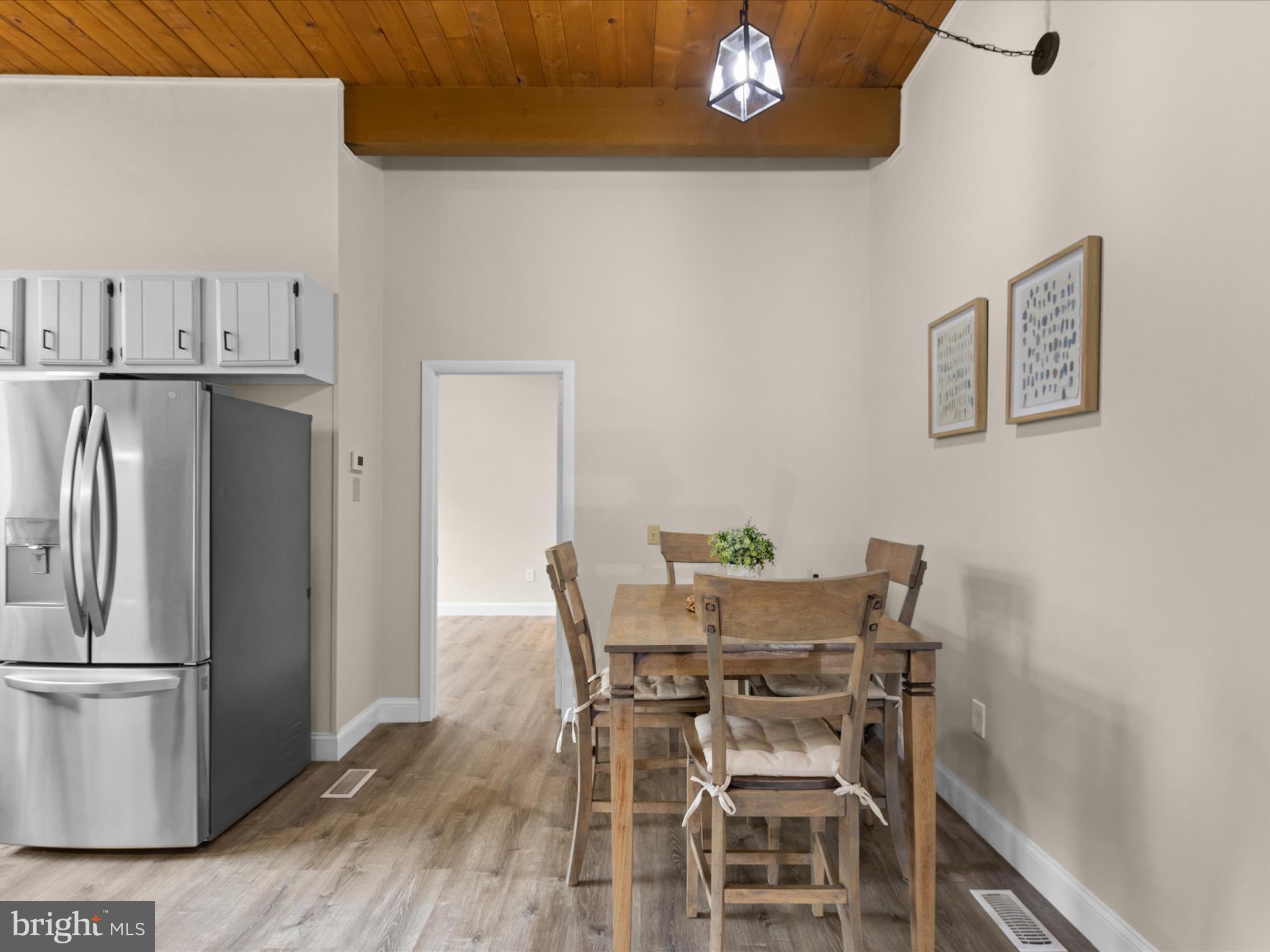 438 Ocean Parkway, Unit 4 Berlin, MD 21811 - Photo 21 of 81 a view of a dining room with furniture and a refrigerator