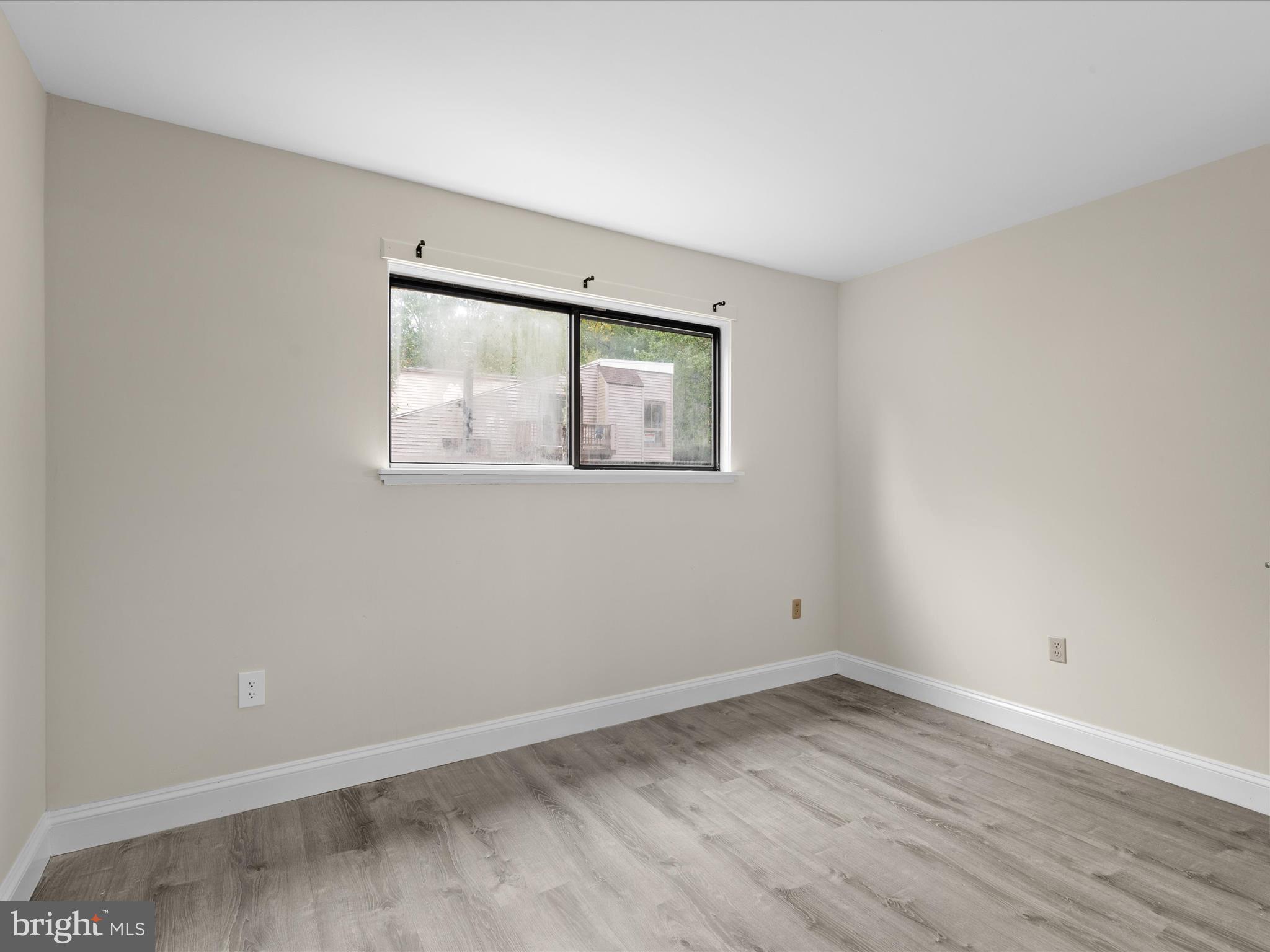438 Ocean Parkway, Unit 4 Berlin, MD 21811 - Photo 35 of 81 an empty room with a window