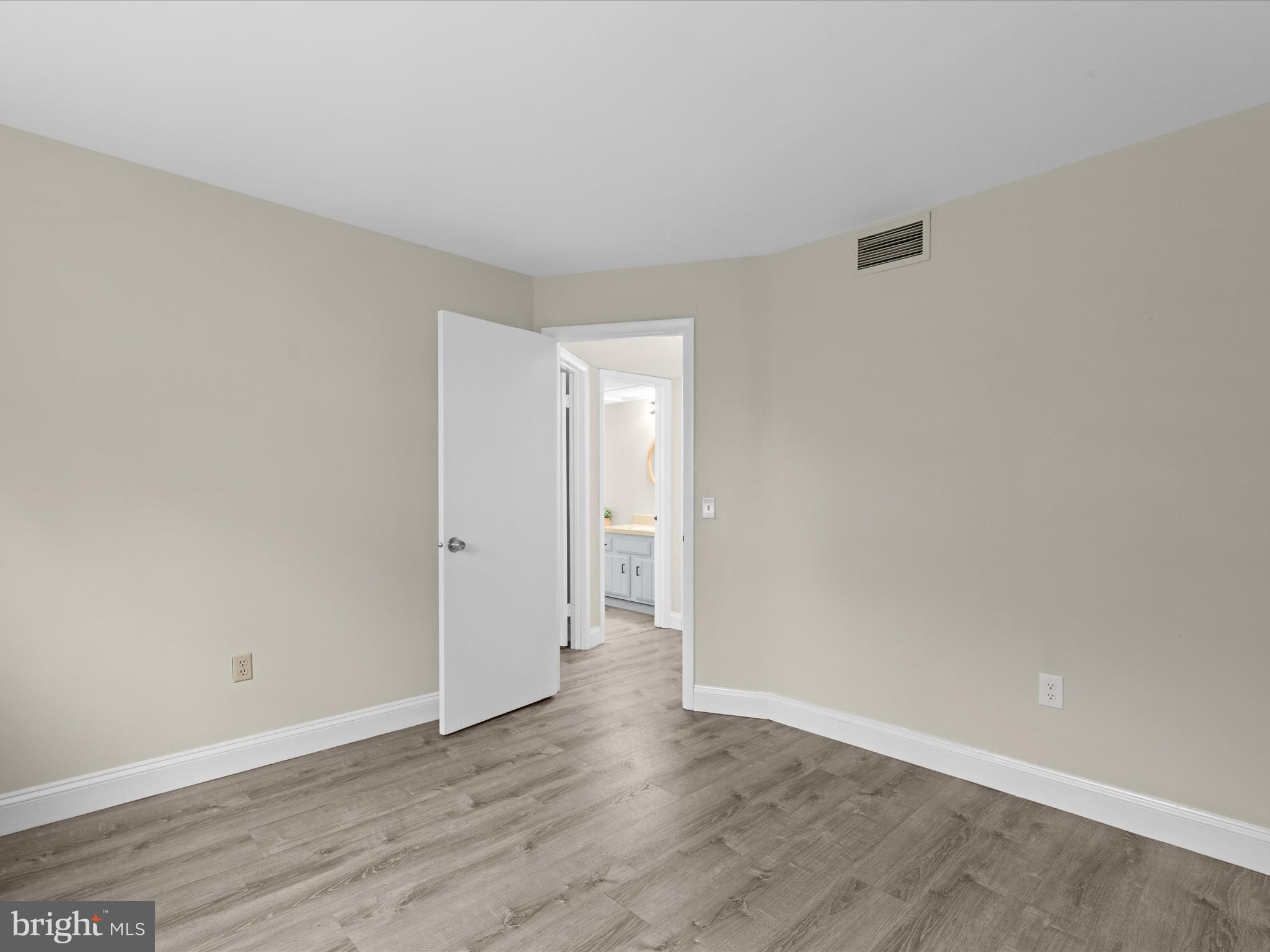 438 Ocean Parkway, Unit 4 Berlin, MD 21811 - Photo 38 of 81 a view of an empty room and wooden floor