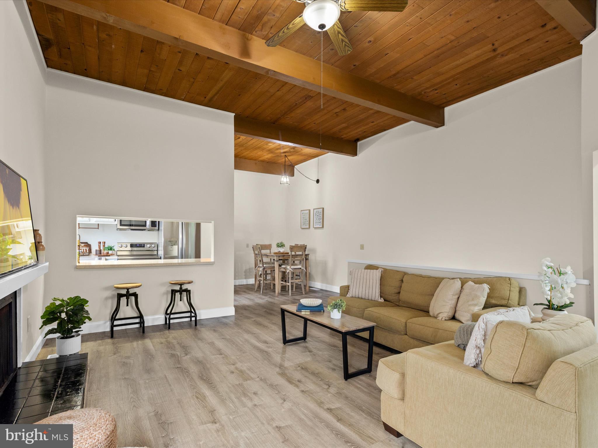 438 Ocean Parkway, Unit 4 Berlin, MD 21811 - Photo 5 of 81 a living room with furniture and wooden floor