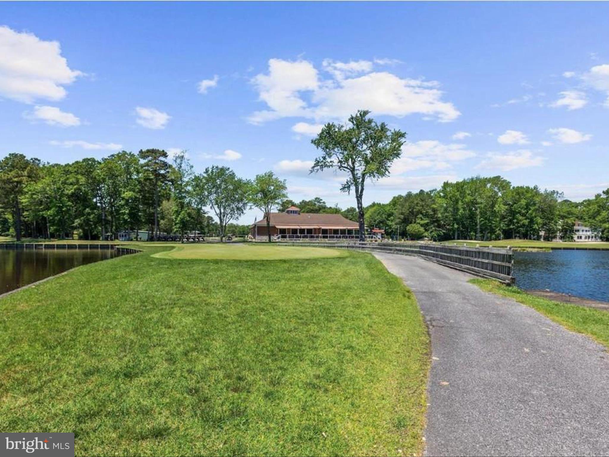 438 Ocean Parkway, Unit 4 Berlin, MD 21811 - Photo 60 of 81 a view of a lake with a yard