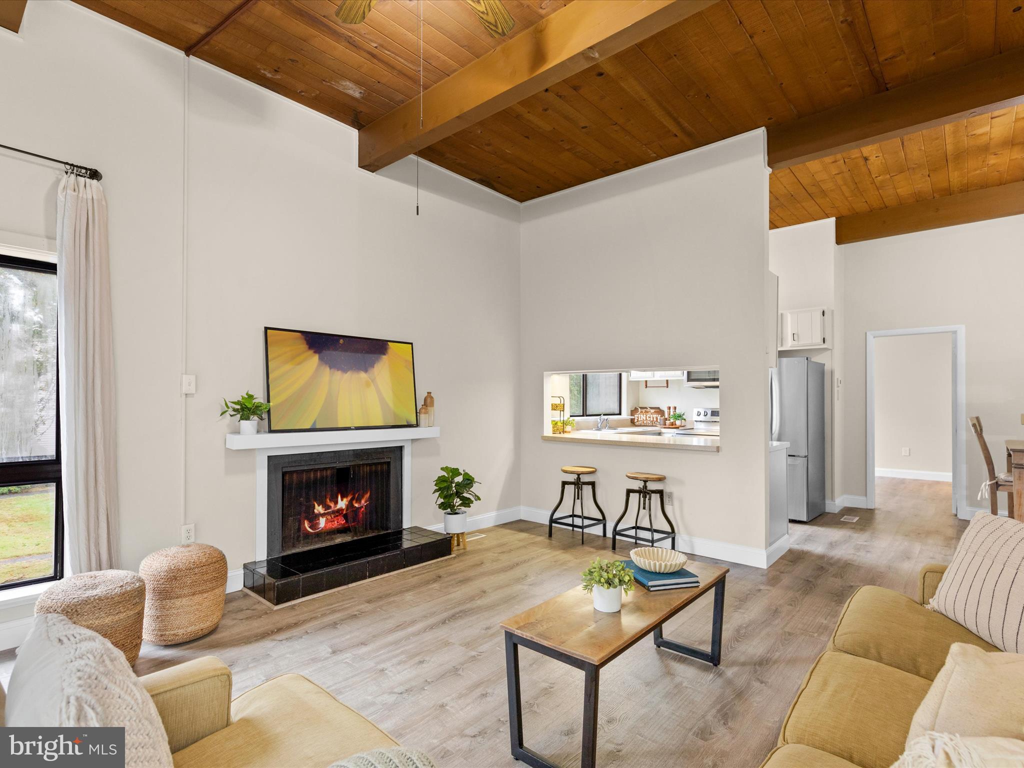 438 Ocean Parkway, Unit 4 Berlin, MD 21811 - Photo 9 of 81 a living room with furniture and a fireplace