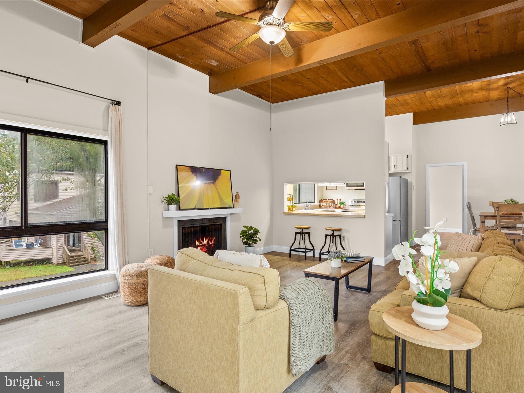 438 Ocean Parkway, Unit 4 Berlin, MD 21811 - Photo 10 of 81 a living room with furniture and a flat screen tv