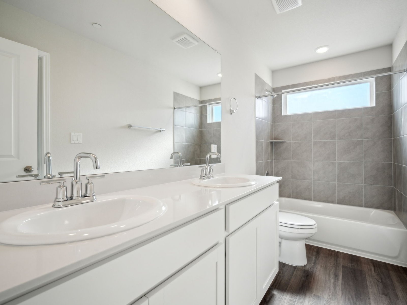 165 Calcite Road, Unit 3 Kyle, TX 78640 - Photo 15 of 17 a bathroom with a double vanity sink toilet and shower