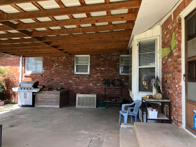 a living room with furniture a rug and a fireplace