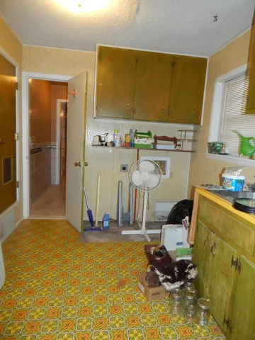a bathroom with a sink mirror vanity and toilet