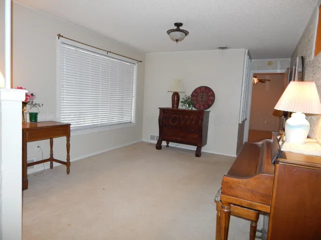 a workspace with furniture and a window