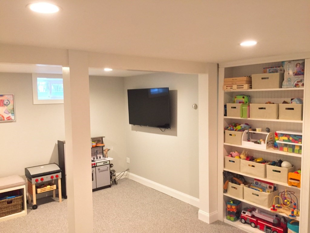 4 Polk Road Hingham, MA 02043 - Photo 19 of 21 a living room with furniture and a flat screen tv