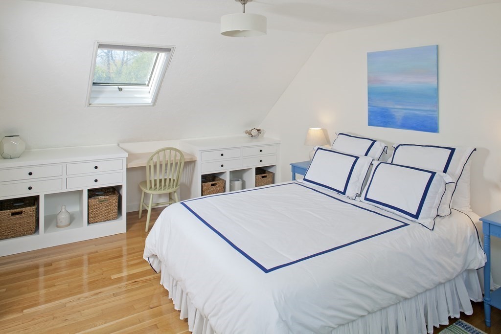 4 Polk Road Hingham, MA 02043 - Photo 8 of 21 a spacious bedroom with a bed and a flat screen tv