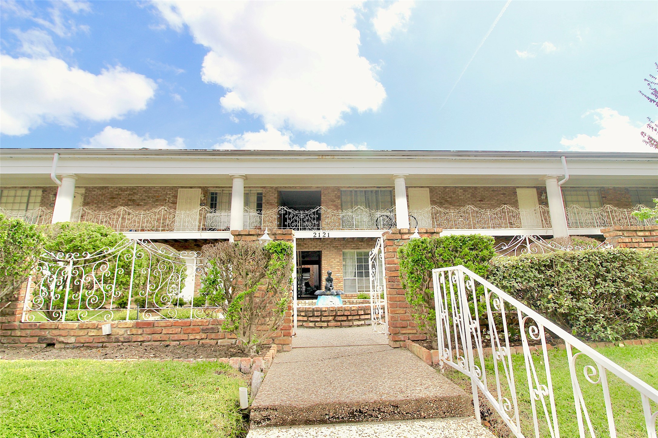 a view of a house with backyard and porch