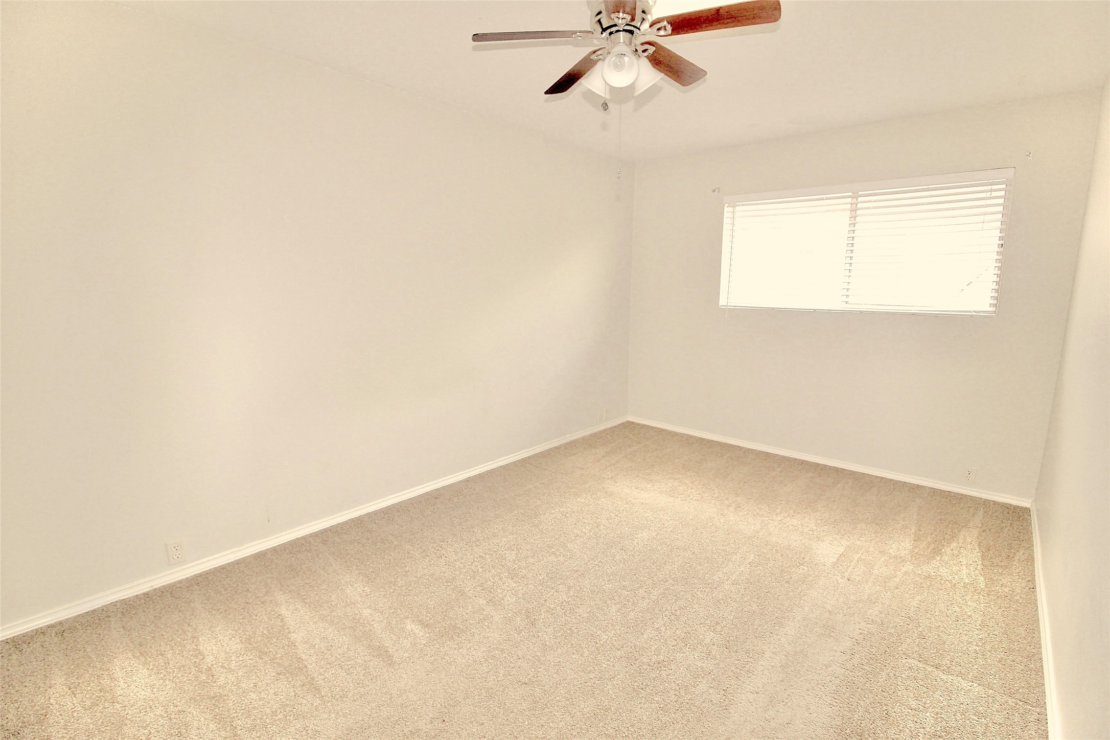 2121 Fountain View Drive, Unit 18 Houston, TX 77057 - Photo 10 of 13 an empty room with a window