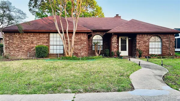 a view of a house with a garden