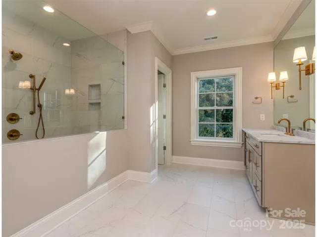 a bathroom with a tub sink and shower
